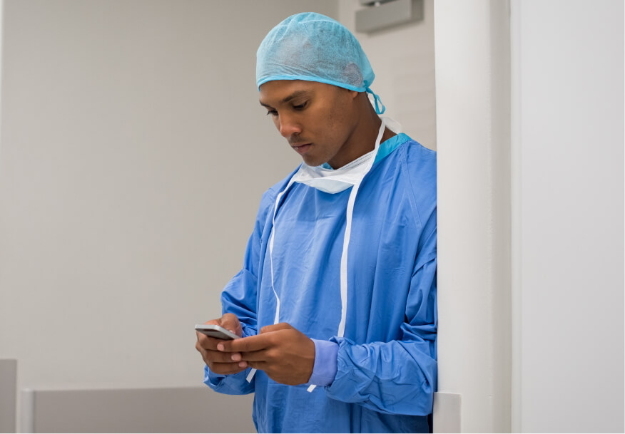 medical resident checking phone