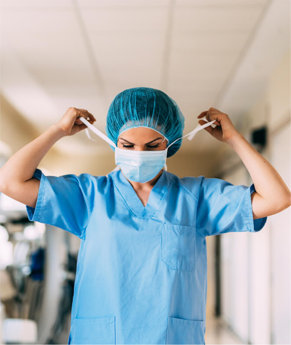putting on a surgical mask