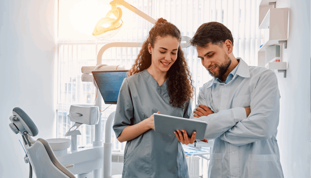 Two dentists standing in an office