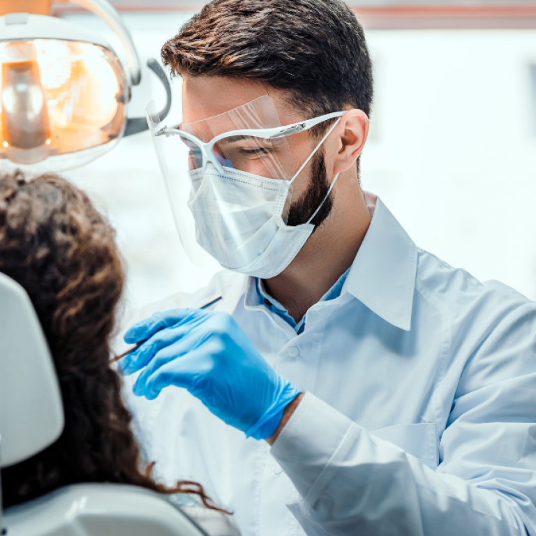 A dentist working on a patient