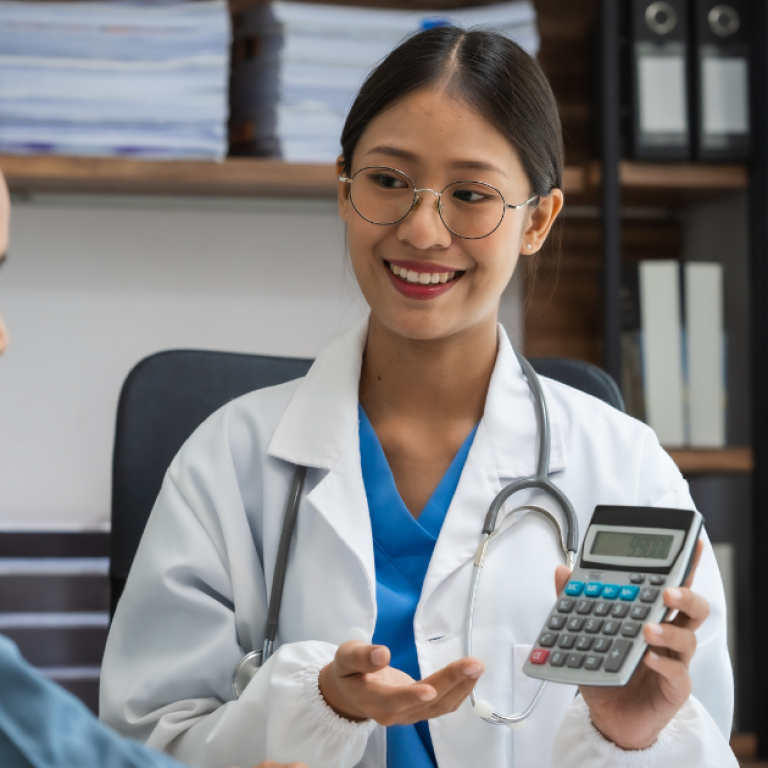 A female doctor displaying something on a calculator