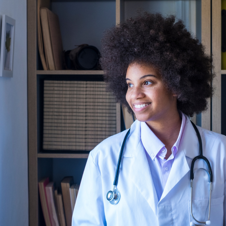 A young doctor looking out a window