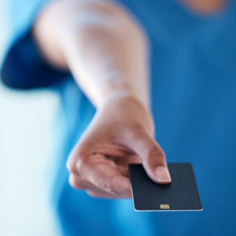 A person holding a credit card.